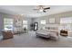 Spacious main bedroom features neutral walls, large windows, sitting area, and carpet flooring at 1749 Grand Oaks Dr, Woodstock, GA 30188