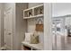 A delightful mudroom features built-in storage, cubbies, and a bench for added convenience at 1749 Grand Oaks Dr, Woodstock, GA 30188