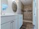 This bathroom features double sinks and a tiled shower at 233 Clayton St, Fairburn, GA 30213
