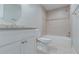 This is a white bathroom with tiled shower and floors, plus a sleek vanity and sink at 233 Clayton St, Fairburn, GA 30213