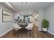 Staged dining area adjacent to the kitchen with modern decor at 233 Clayton St, Fairburn, GA 30213
