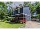 Picture of the house showcasing its quaint design, porch, and spacious yard, perfect for outdoor enjoyment at 233 Clayton St, Fairburn, GA 30213