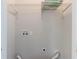 Empty Laundry room with white walls, shelving, and hookups for a washer and dryer at 233 Clayton St, Fairburn, GA 30213