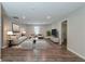 Cozy living room with recessed lights, wood flooring, and stylish contemporary furnishings at 233 Clayton St, Fairburn, GA 30213