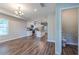 Open living space with modern white kitchen, dining area, and ample counter space at 233 Clayton St, Fairburn, GA 30213