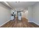 Spacious open-concept living area with a modern kitchen, complete with an island and stainless appliances at 233 Clayton St, Fairburn, GA 30213