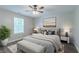 Stylish main bedroom featuring wood-look floors and modern decor at 233 Clayton St, Fairburn, GA 30213