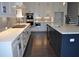 Gourmet kitchen with stainless appliances, white cabinets and kitchen island at 333 Mont Harmony Sw Rd, Powder Springs, GA 30127
