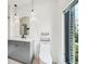 Modern bathroom featuring a sleek vanity, black fixtures, and a bright window with a view at 71 Krog Ne St, Atlanta, GA 30307