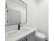 Stylish powder room with modern fixtures, vessel sink, and sleek mirror, ideal for guests at 71 Krog Ne St, Atlanta, GA 30307