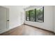Clean bedroom features hardwood floors, natural light from window, and neutral tones creating a serene atmosphere at 71 Krog Ne St, Atlanta, GA 30307