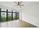 Bright bedroom with large windows, hardwood floors, and modern ceiling fan at 71 Krog Ne St, Atlanta, GA 30307