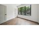 Inviting bedroom featuring large window and hardwood floors at 71 Krog Ne St, Atlanta, GA 30307