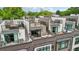 View of modern townhomes showcasing private rooftop decks with outdoor seating and dining areas at 71 Krog Ne St, Atlanta, GA 30307