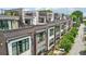 View of modern townhomes with brick and white siding, bay windows, and rooftop terraces at 71 Krog Ne St, Atlanta, GA 30307