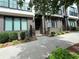 Attractive brick townhome exterior featuring well-maintained landscaping, a walkway, and dark trim at 71 Krog Ne St, Atlanta, GA 30307