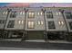 Modern townhomes boast garages and sleek exteriors, providing convenient and stylish urban living at 71 Krog Ne St, Atlanta, GA 30307