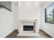 Close-up of the modern fireplace and dark hardwood flooring at 71 Krog Ne St, Atlanta, GA 30307