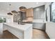 Spacious kitchen featuring a large island, modern pendant lighting, and stainless steel appliances at 71 Krog Ne St, Atlanta, GA 30307