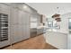 Spacious kitchen featuring a large island, stainless steel appliances, and a wine refrigerator at 71 Krog Ne St, Atlanta, GA 30307