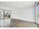 Bright living room with hardwood floors and access to a private balcony at 71 Krog Ne St, Atlanta, GA 30307