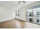 Spacious living room featuring a modern ceiling and a sliding glass door leading to the outside at 71 Krog Ne St, Atlanta, GA 30307