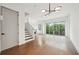 Open concept living space with staircase and sliding glass doors to balcony at 71 Krog Ne St, Atlanta, GA 30307