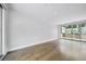 Bright living room with hardwood floors and access to a private balcony at 71 Krog Ne St, Atlanta, GA 30307