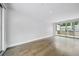 Bright living room with wood floors and sliding glass doors offers ample natural light at 71 Krog Ne St, Atlanta, GA 30307
