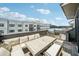 Outdoor patio with cushioned seating, outdoor table, and grill at 71 Krog Ne St, Atlanta, GA 30307