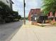 A street view of the building with parking and the Krog Street District sign on a partly cloudy day at 71 Krog Ne St, Atlanta, GA 30307