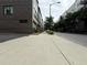 A street view of a row of modern townhomes with sidewalks and streetlights on a cloudy day at 71 Krog Ne St, Atlanta, GA 30307