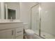 This bathroom features a single sink vanity with a walk-in shower with glass doors at 123 Matson Sw Run, Mableton, GA 30126