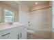 This bathroom has a white vanity, a tub shower, and a window for natural lighting at 123 Matson Sw Run, Mableton, GA 30126