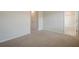 This bedroom features neutral carpet and leads into a nearby bathroom at 123 Matson Sw Run, Mableton, GA 30126