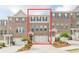 Charming townhome boasts a brick facade, two-car garage, and inviting curb appeal at 123 Matson Sw Run, Mableton, GA 30126
