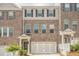 Stylish brick townhome with a two-car garage and well-maintained landscaping at 123 Matson Sw Run, Mableton, GA 30126