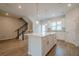 Bright kitchen features a large island, stainless steel appliances, and hardwood flooring at 123 Matson Sw Run, Mableton, GA 30126