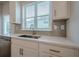 Well-lit kitchen sink area with modern faucet, cabinetry and window at 123 Matson Sw Run, Mableton, GA 30126