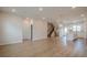 Spacious living room with hardwood floors leading to open staircase and kitchen at 123 Matson Sw Run, Mableton, GA 30126