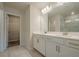 Bathroom boasts double sinks, neutral tiling, and walk-in closet at 123 Matson Sw Run, Mableton, GA 30126