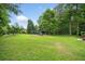 Spacious backyard featuring well-maintained lawn and a playset at 2166 Carlyle Dr, Marietta, GA 30062