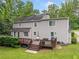 Home exterior view showing a spacious deck and yard with mature trees at 2166 Carlyle Dr, Marietta, GA 30062