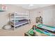 Bedroom featuring a white bunk bed frame, beige carpet, and ample natural light at 2166 Carlyle Dr, Marietta, GA 30062