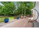 Relaxing deck area with a hanging chair and outdoor furniture, perfect for enjoying the backyard view at 2166 Carlyle Dr, Marietta, GA 30062