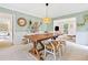 Light-filled dining room with rustic table, views to the other living spaces at 2166 Carlyle Dr, Marietta, GA 30062