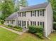 Charming two-story home with a well-manicured lawn and mature landscaping at 2166 Carlyle Dr, Marietta, GA 30062