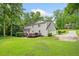 Rear exterior featuring a spacious deck and a two-car garage at 2166 Carlyle Dr, Marietta, GA 30062