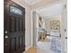 Welcoming foyer with wood floors, an ornate front door, and a glimpse into the brightly lit living spaces at 2166 Carlyle Dr, Marietta, GA 30062