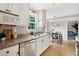 Stylish kitchen features granite countertops, stainless steel appliances, and an adjacent dining area at 2166 Carlyle Dr, Marietta, GA 30062